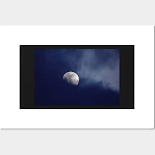 Moon behind dark blue clouds Posters and Art